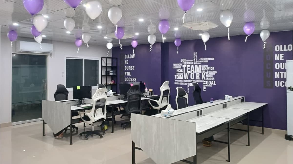 Purple-branded workspace with workstations