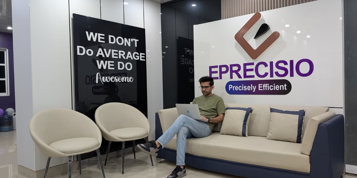 Eprecisio office with branded wall and team workspace
